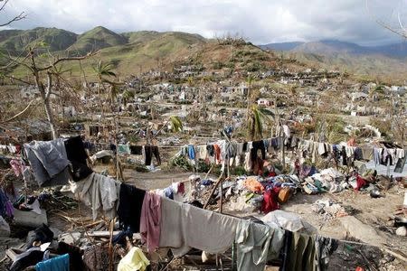 Clothes hang in an area destroyed by Hurricane Matthew in Les Anglais, Haiti, October 11, 2016. REUTERS/Andres Martinez Casares