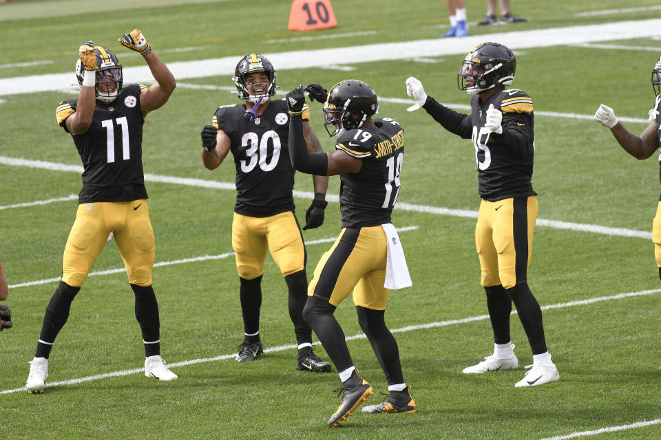 Pittsburgh Steelers wide receiver JuJu Smith-Schuster (19) dances with teammates in the end zone after catching a pass against the Houston Texans and running it in for a touchdown in the first half of an NFL football game, Sunday, Sept. 27, 2020, in Pittsburgh. (AP Photo/Don Wright)