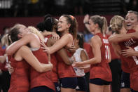 Players from the United States react after defeating Brazil in the gold medal match in women's volleyball at the 2020 Summer Olympics, Sunday, Aug. 8, 2021, in Tokyo, Japan. (AP Photo/Manu Fernandez)