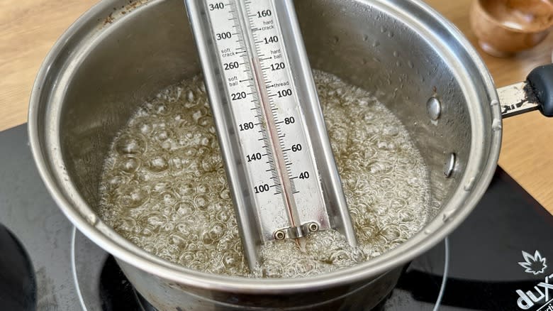 Sugar syrup with candy thermometer