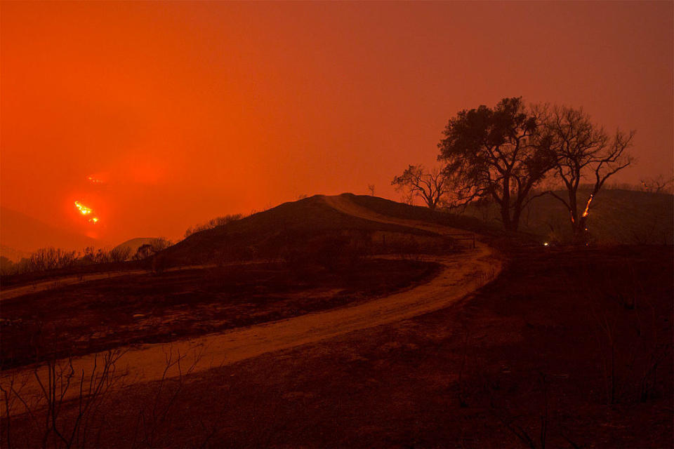 <p>Fire spreads through the night in Placerita Canyon.</p>