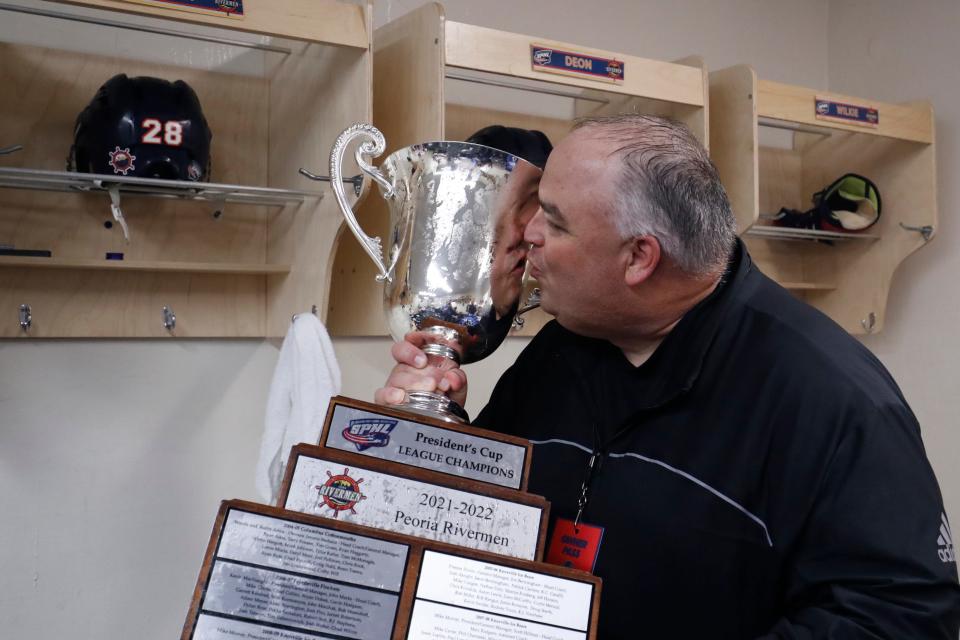 Peoria Rivermen co-owner Bart Rogers celebrates with the SPHL President's Cup after his team won Game 4 of the championship series over Roanoke to clinch the title at Berglund Center on May 3, 2022.