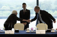 Treasury Secretary Janet Yellen, left, shakes hands with Jens Eskelund, president of the European Union Chamber of Commerce in China, as she arrives at the Business Leaders Roundtable meeting at Baiyun International Conference Center (BICC) in southern China's Guangdong province, Friday, April 5, 2024. Yellen has arrived in China for five days of meetings in a country that's determined to avoid open conflict with the United States. (AP Photo/Andy Wong, Pool)