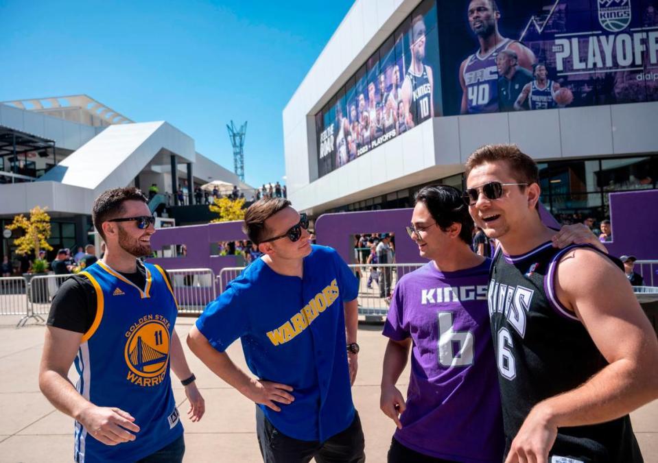 Golden State Warriors fans Jared Rose, 24, left, and Blake Landis, 24, both from the Bay Area, face off with Sacramento Kings fans Daniel Shevchyk, 24, and John “JC” Dossantos, 23, both East Sacramento residents, at Downtown Commons before their teams meet in the first game of their NBA playoff series on Saturday, April 15, 2023.