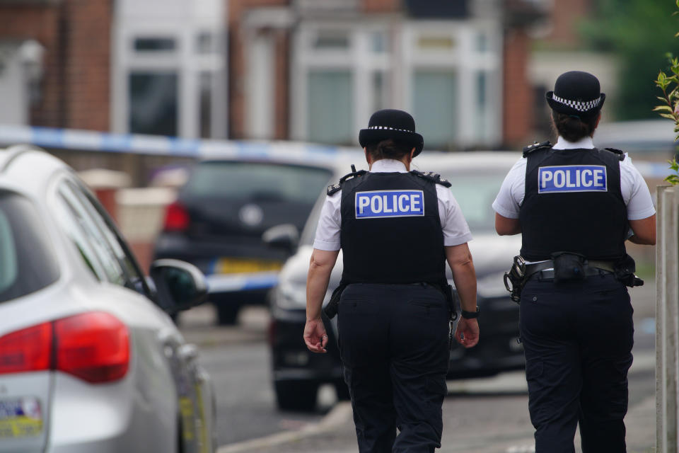 Police officers near to the scene in Kingsheath Avenue, Knotty Ash, Liverpool, where a nine-year-old girl has been fatally shot. Officers from Merseyside Police have started a murder investigation after attending a house at 10pm Monday following reports that an unknown male had fired a gun inside the property. Picture date: Tuesday August 23, 2022.