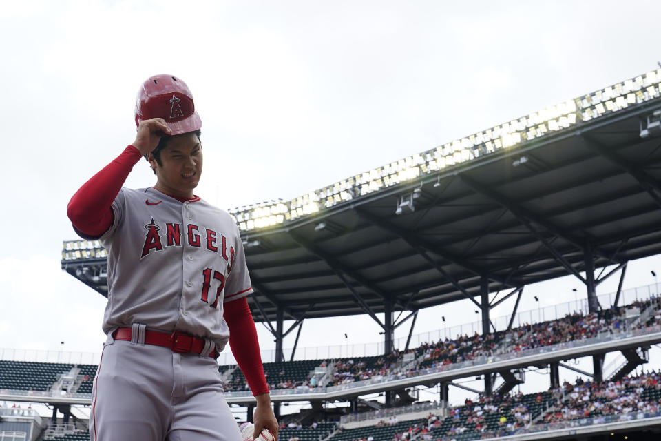 Los Angeles Angels' Shohei Ohtani (17) walks off the field in the first inning of a baseball game against the Atlanta Braves, Wednesday, Aug. 2, 2023, in Atlanta. (AP Photo/Brynn Anderson)