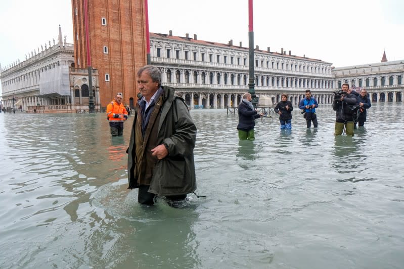 The Mayor of Venice Luigi Brugnaro walks on St Mark's Square during an exceptionally high water levels in Venice