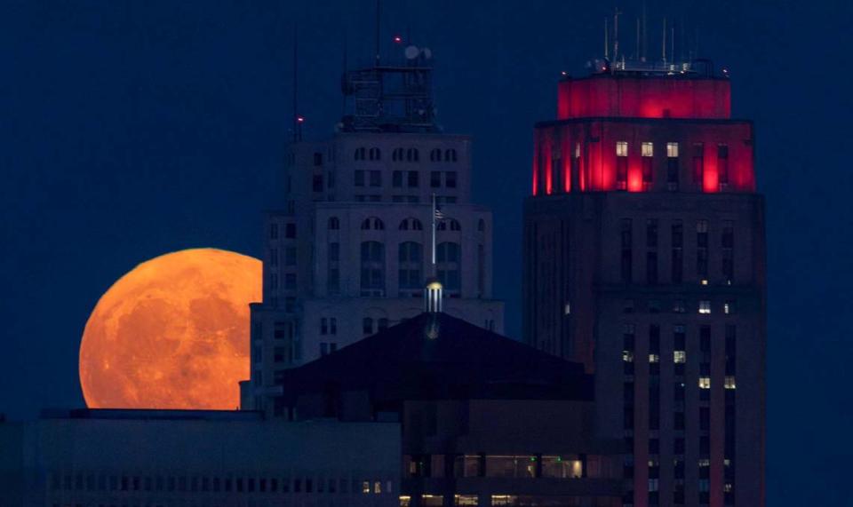 A super blue moon rises over the Kansas City skyline on Wednesday, Aug. 30, 2023. It is known as a supermoon since it was at its closest point to Earth and as the second full moon of the month, it’s also known as a blue moon.