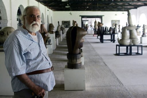 In this file photo taken on March 29, 2008 Brazilian artist Francisco Brennand poses next to his sculptures in his "Office" in Recife, northeast Brazil