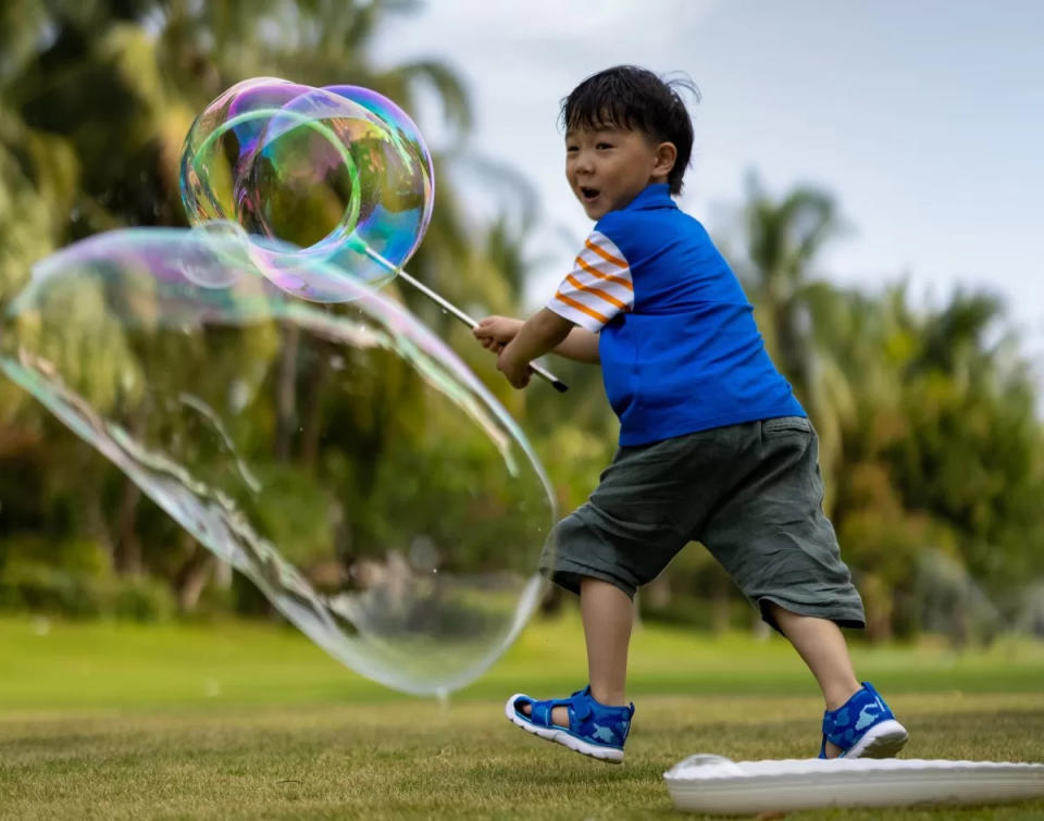 boy playing with bubble