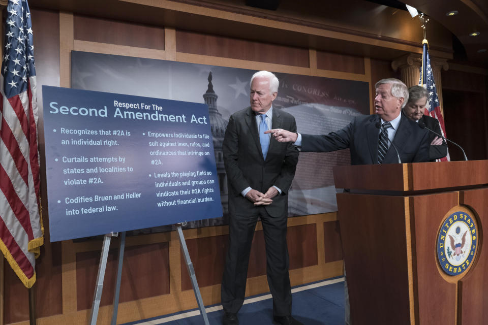 FILE - Republican members of the Senate Judiciary Committee, from left, Sen. John Cornyn, R-Texas, Sen. Lindsey Graham, R-S.C., and Sen. John Kennedy, R-La., speak to reporters about their proposed gun ownership legislation at the Capitol in Washington, Thursday, March 16, 2023. (AP Photo/J. Scott Applewhite, File)