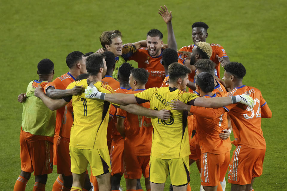 FC Cincinnati players celebrate a win over Toronto FC in an MLS soccer match Saturday, Sept. 30, 2023, in Toronto. (Chris Young/The Canadian Press via AP)