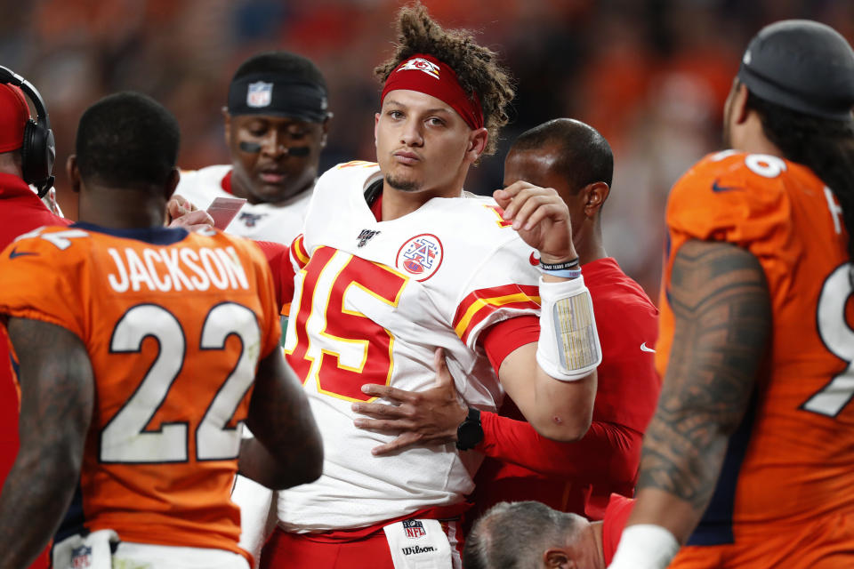 Kansas City Chiefs quarterback Patrick Mahomes (15) is helped off the field after being injured against the Denver Broncos during the first half of an NFL football game, Thursday, Oct. 17, 2019, in Denver. (AP Photo/David Zalubowski)