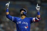 Toronto Blue Jays' Lourdes Gurriel Jr. celebrates his solo home run off Tampa Bay Rays pitcher Shane Baz during the fifth inning of a baseball game Monday, Sept. 20, 2021, in St. Petersburg, Fla. (AP Photo/Chris O'Meara)