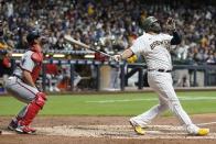 Milwaukee Brewers' Rowdy Tellez hits a two-run home run during the sixth inning of a baseball game against the Washington Nationals Friday, May 20, 2022, in Milwaukee. (AP Photo/Morry Gash)