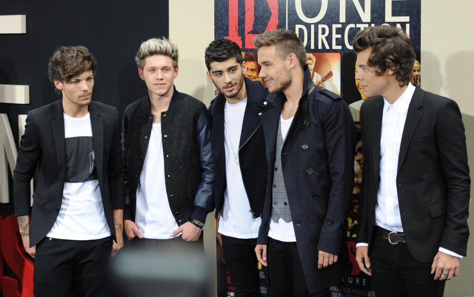 British boy band One Direction, from left, Louis Tomlinson, Niall Horan, Zayn Malik, Liam Payne and Harry Styles attend the premiere of 