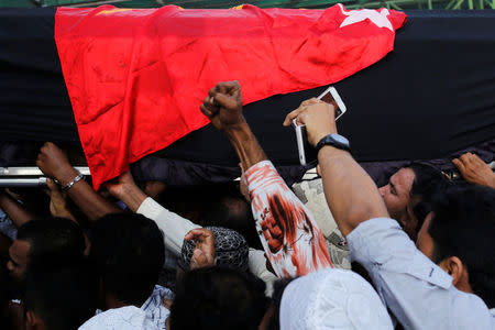 Supporters carry the coffin of Ko Ni, a prominent member of Myanmar's Muslim minority and legal adviser for Myanmar's ruling National League for Democracy, after he was shot dead, in Yangon, Myanmar January 30, 2017. REUTERS/Soe Zeya Tun