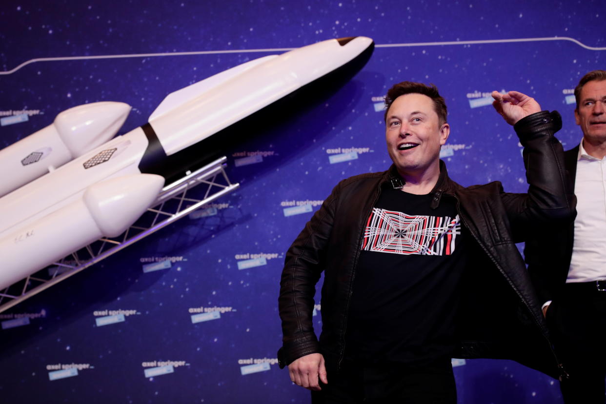 SpaceX owner and Tesla CEO Elon Musk jokes after arriving on the red carpet for the Axel Springer award, in Berlin, Germany, December 1, 2020. REUTERS/Hannibal Hanschke/Pool