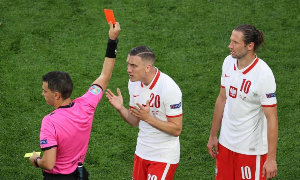 Poland’s Grzegorz Krychowiak (right) is sent off in the second half.