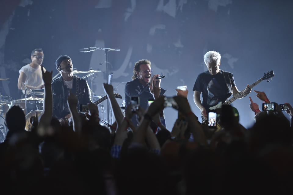 FILE - Larry Mullen Jr, left, The Edge, Bono and Adam Clayton of U2 perform during a concert at the Apollo Theater hosted by SiriusXM on June 11, 2018, in New York. (Photo by Evan Agostini/Invision/AP, File)