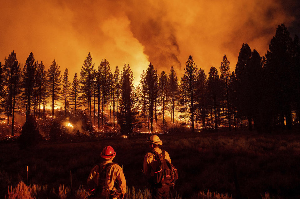 Firefighters monitor the Sugar Fire, part of the Beckwourth Complex Fire, as it burns at Frenchman Lake in Plumas National Forest, Calif., on Thursday, July 8, 2021. (AP Photo/Noah Berger)
