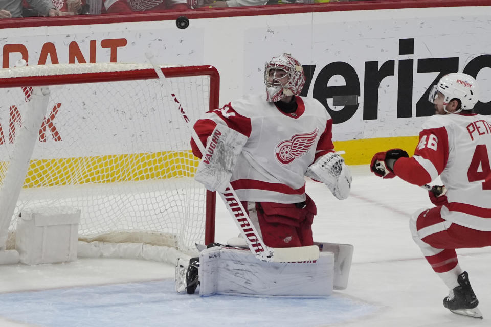 Detroit Red Wings defenseman Jeff Petry (46) watches as the puck deflects from goaltender Alex Lyon (34) near the net during first period an NHL hockey game against the Florida Panthers, Wednesday, Jan. 17, 2024, in Sunrise, Fla. (AP Photo/Marta Lavandier)