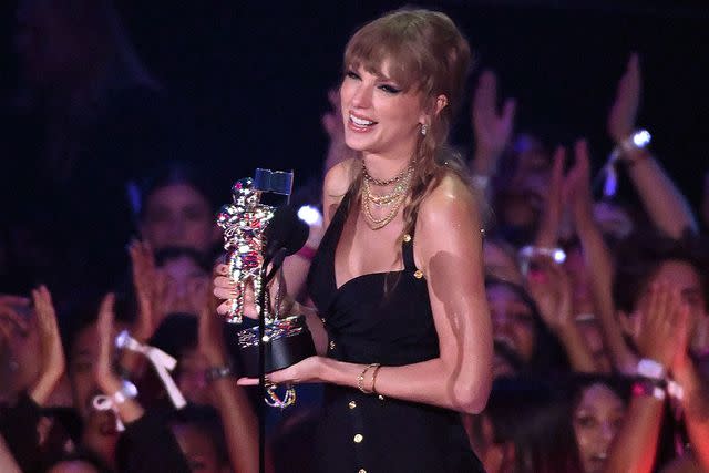 <p>Noam Galai/Getty</p> Taylor Swift accepts an award at the 2023 MTV VMAs