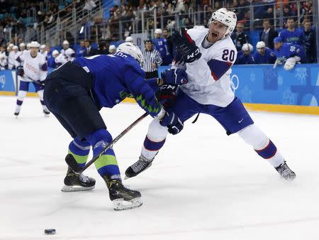 Ice Hockey - Pyeongchang 2018 Winter Olympics - Men's Playoff Match - Slovenia v Norway - Gangneung Hockey Centre, Gangneung, South Korea - February 20, 2018 - Blaz Gregorc of Slovenia and Anders Bastiansen of Norway in action. REUTERS/Kim Kyung-Hoon