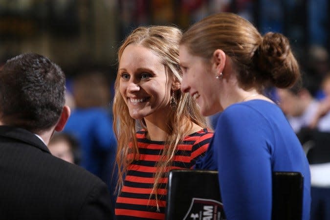 Carissa Thielbar (center) is an assistant coach for the South Dakota State women's basketball team.