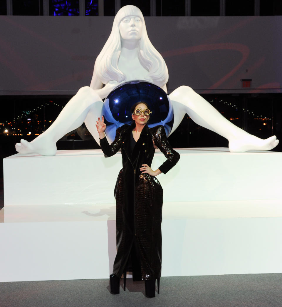 Lady Gaga unveils a sculpture of herself by artist Jeff Koons during the ARTPOP album release and artRave event at the Brooklyn Navy Yard on Sunday, Nov. 10, 2013 in New York. (Photo by Evan Agostini/Invision/AP)