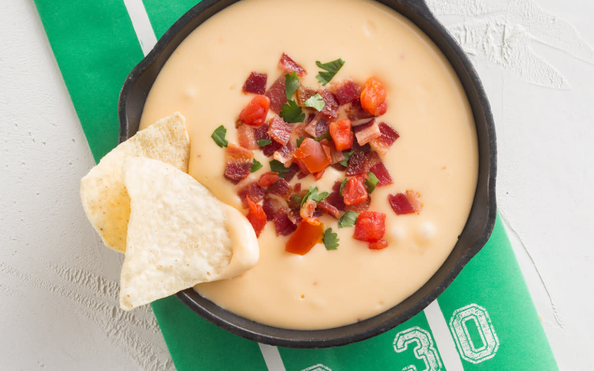 <p>MARK BOUGHTON PHOTOGRAPHY / STYLING BY TERESA BLACKBURN</p><p>Start with this easy, cheesy five-ingredient dip, then customize it with fan-favorite mix-ins and toppings.</p><p><strong>Get the recipe: </strong><strong><a href="https://parade.com/842572/communitytable/make-it-yours-queso-dip/" rel="nofollow noopener" target="_blank" data-ylk="slk:Make-It-Yours Queso Dip;elm:context_link;itc:0;sec:content-canvas" class="link rapid-noclick-resp">Make-It-Yours Queso Dip</a></strong></p>