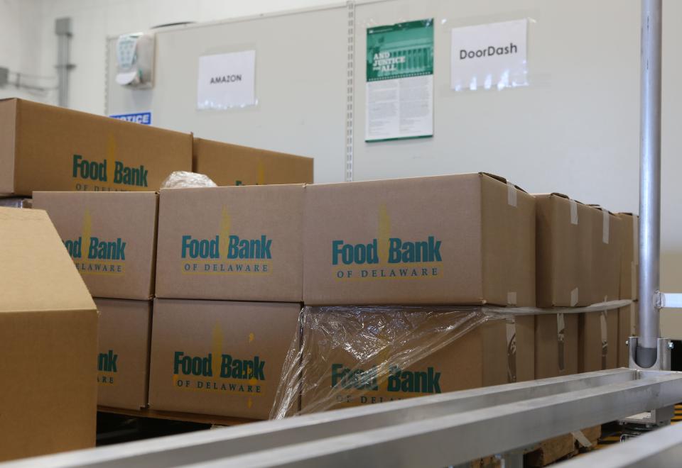 Boxes of food at the Food Bank of Delaware's Glasgow location await pickup by DoorDash and Amazon Flex drivers.