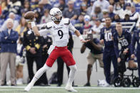 Cincinnati quarterback Desmond Ridder throws a pass against Navy during the first half of an NCAA college football game, Saturday, Oct. 23, 2021, in Annapolis, Md. (AP Photo/Julio Cortez)