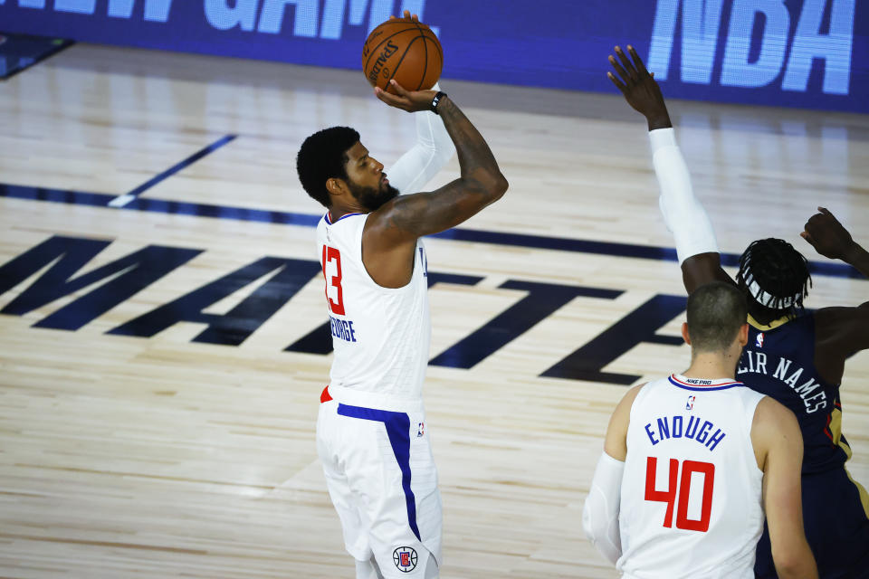 LAKE BUENA VISTA, FLORIDA - AUGUST 01: Paul George #13 of the LA Clippers shoots against the New Orleans Pelicans at HP Field House at ESPN Wide World Of Sports Complex on August 01, 2020 in Lake Buena Vista, Florida. NOTE TO USER: User expressly acknowledges and agrees that, by downloading and or using this photograph, User is consenting to the terms and conditions of the Getty Images License Agreement. (Photo by Kevin C. Cox/Getty Images)