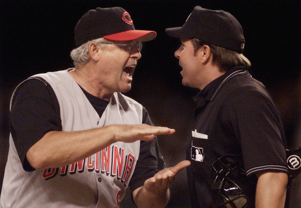 Cincinnati Reds manager Bob Boone (L) tells home plate umpire Doug  Eddings (R) that Arizona Diamondbacks Byung-Hyun Kim's first pitch to  Reds shortstop Barry Larkin during the ninth inning in Phoenix,  Arizona, August 20, 2002 was far below Larkin's knees and should not  have been called a strike. Boone was thrown out of the game, the Reds  lost to the Diamondbacks 5-3 and Kim earned his 30th save of the year,  tying a franchise record. REUTERS/Jeff Topping    JT