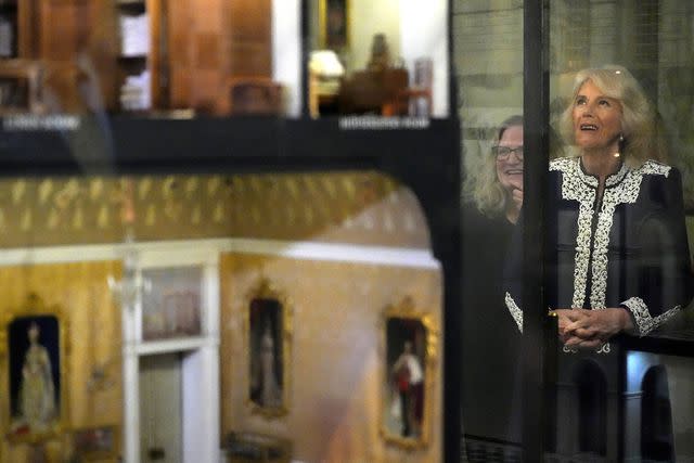 <p>KIRSTY WIGGLESWORTH/POOL/AFP via Getty Images</p> Queen Camilla at the Windsor Castle reception for the new Miniature Library collection on Jan. 30.