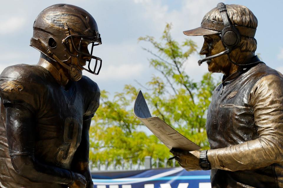 In this Sept. 5, 2018, file photo, a bronze statue depicting Philadelphia Eagles quarterback Nick Foles, left, and head coach Doug Pederson discussing the "Philly Special" trick play is seen at Lincoln Financial Field, in Philadelphia. Facing the mighty New England Patriots on the NFL's biggest stage, Philadelphia Eagles coach Doug Pederson's decision to try a trick play — the "Philly Special" — on a fourth down late in the first half of Super Bowl 52 will be remembered as one of the gutsiest calls in sports history.