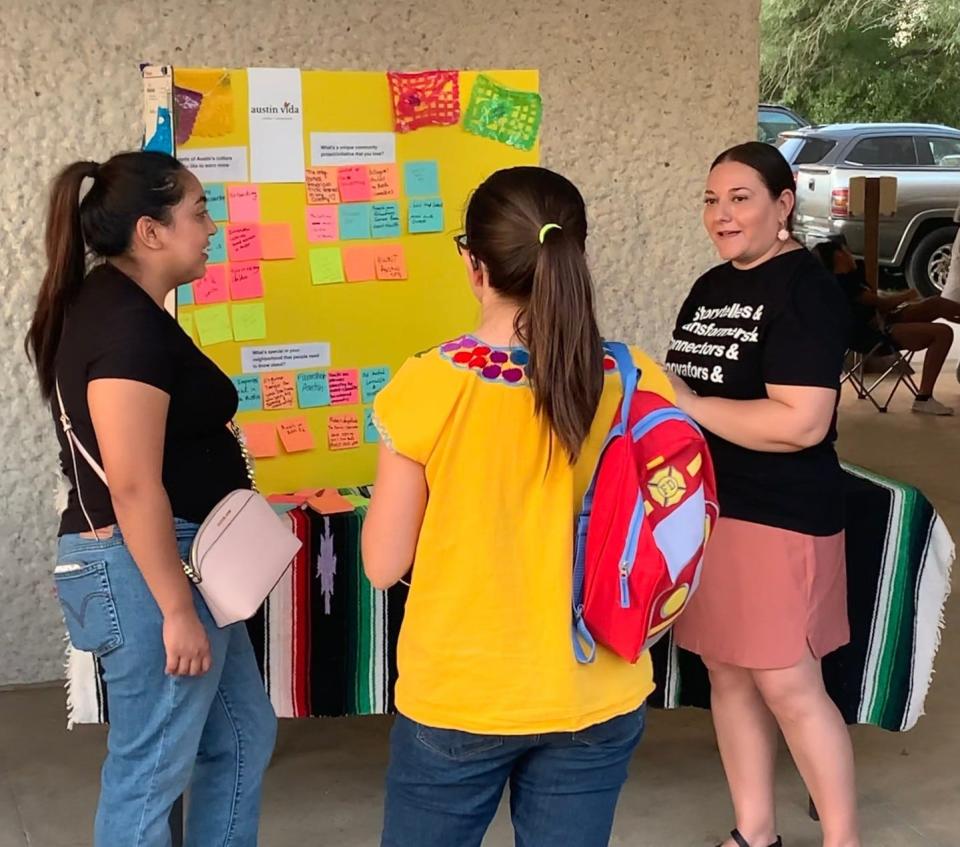 Nancy Flores talks to visitors at an Austin Vida community engagement event at the Emma S. Barrientos Mexican American Cultural Center. Flores hopes "Austin taps into the power of collaboration to push the needle forward on our big ideas" in 2024.