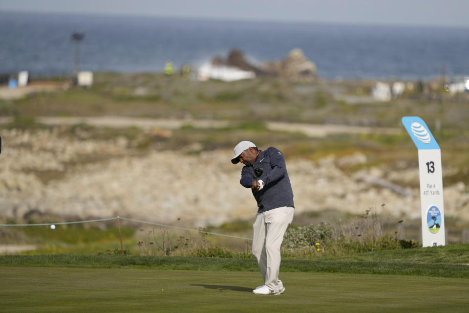 Alfonso Ribeiro hits from the 13th tee of the Monterey Peninsula Country Club Shore Course during the third round of the AT&T Pebble Beach Pro-Am golf tournament in Pebble Beach, Calif., Saturday, Feb. 5, 2022. (AP Photo/Tony Avelar)