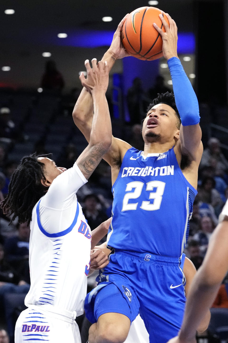 Creighton guard Trey Alexander, right, drives to the basket against DePaul guard Jalen Terry during the first half of an NCAA college basketball game in Chicago, Tuesday, Jan. 9, 2024. (AP Photo/Nam Y. Huh)
