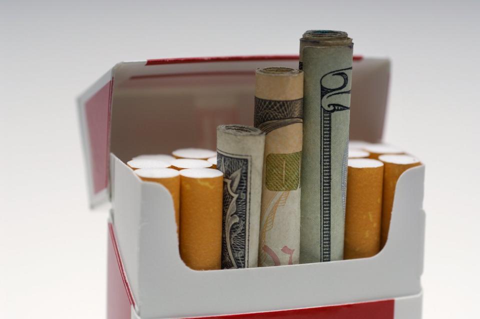 The money was rolled up and put in a cigarette box like cigarettes.
