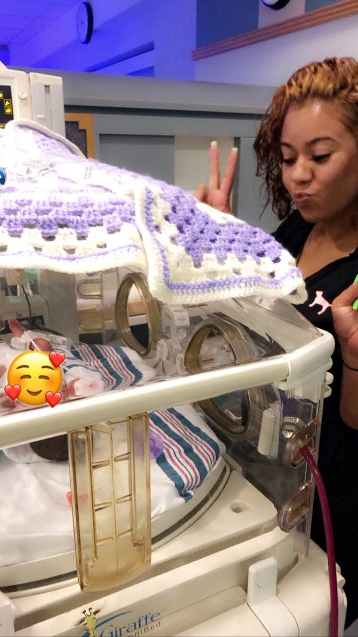 Alexandra Santos with her niece Amoura Rose at the hospital.
