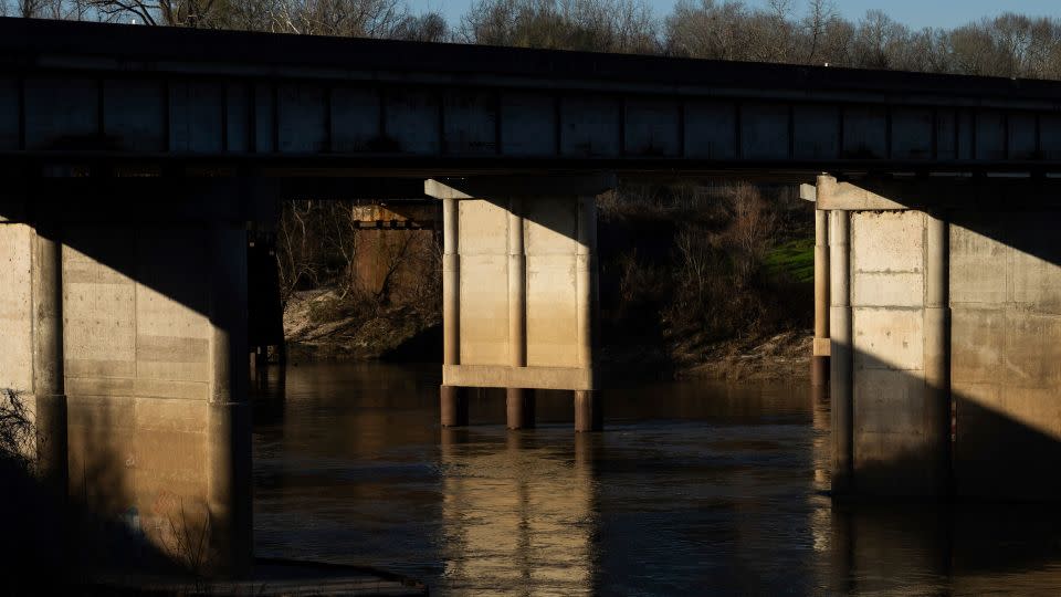 Divers recovered the body of Audrii Cunningham near this part of the Trinity River on Tuesday. - Jason Fochtman/Houston Chronicle/AP