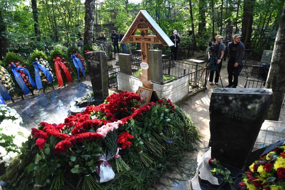 Members of the media gather near the grave of Wagner private mercenary group chief Yevgeny Prigozhin, who was killed in a private jet crash (AFP via Getty Images)