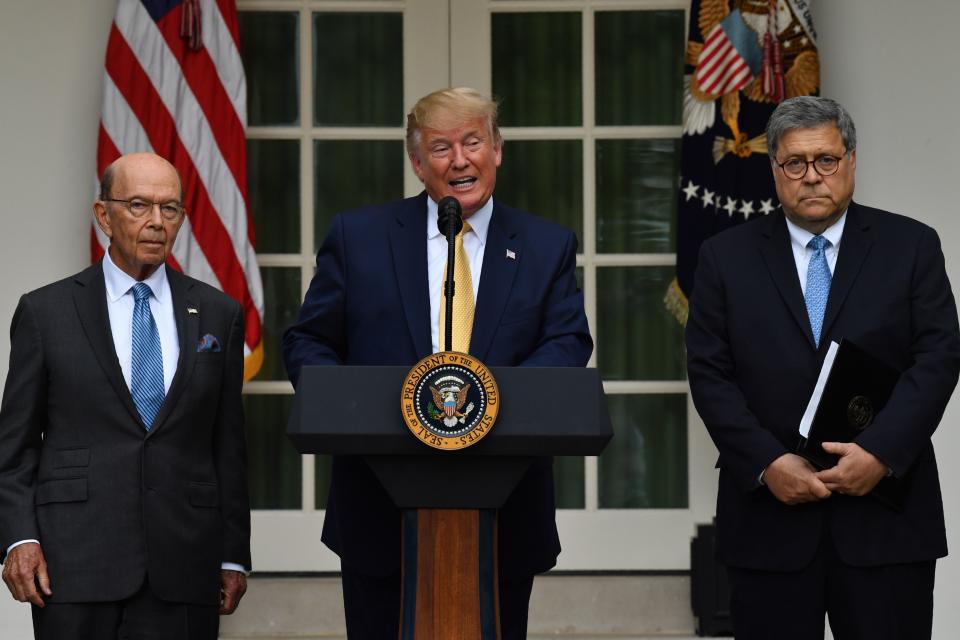 US President Donald Trump (C), flanked by US Secretary of Commerce Wilbur Ross (L) and US Attorney General William Barr, delivers remarks on citizenship and the census in the Rose Garden at the White House in Washington, DC, on July 11, 2019. (Photo by Nicholas Kamm / AFP)        (Photo credit should read NICHOLAS KAMM/AFP/Getty Images)