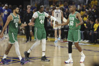Boston Celtics forward Jayson Tatum (0) celebrates with center Robert Williams III (44) and center Al Horford (42) during the first half of Game 1 of basketball's NBA Finals against the Golden State Warriors in San Francisco, Thursday, June 2, 2022. (AP Photo/Jed Jacobsohn)