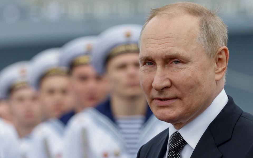 Vladimir Putin attends a parade marking Navy Day in Saint Petersburg, Russia  - REUTERS/Maxim Shemetov