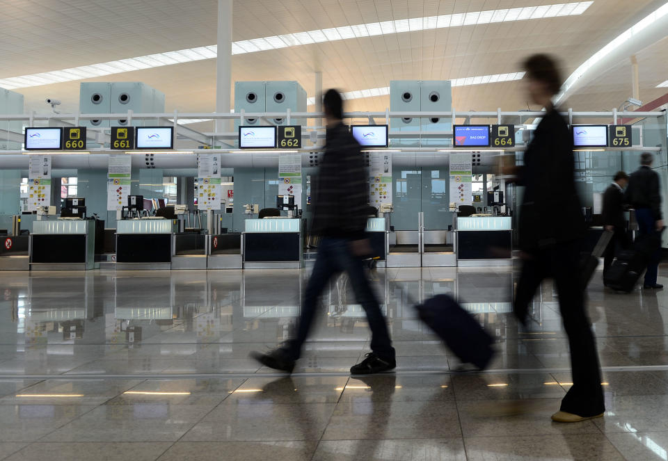 The empty Delta Air Lines check in area at the international airport in Barcelona, Spain, Tuesday, Oct. 30, 2012. In the aftermath of superstorm Sandy, airports hundreds of thousands of travelers across the U.S. and around the world are stranded. (AP Photo/Manu Fernandez)