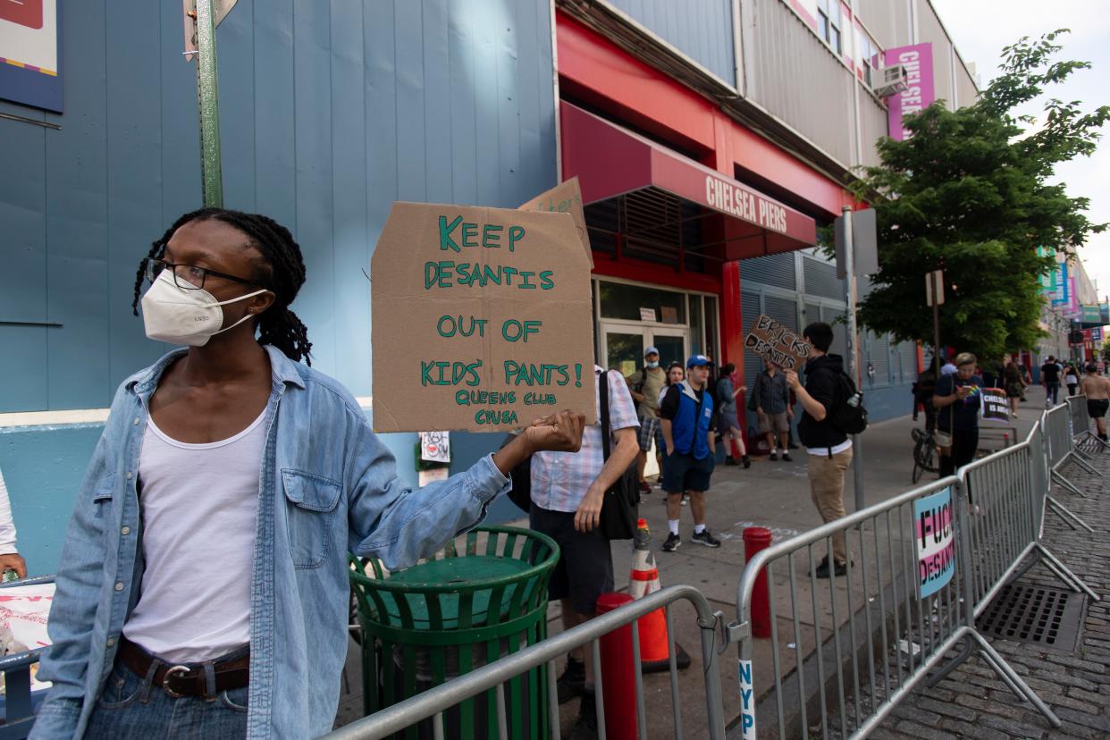 Protestors outside of Chelsea Piers gathered to protest over Florida Gov. Ron DeSantis speaking at an event on Sunday. 