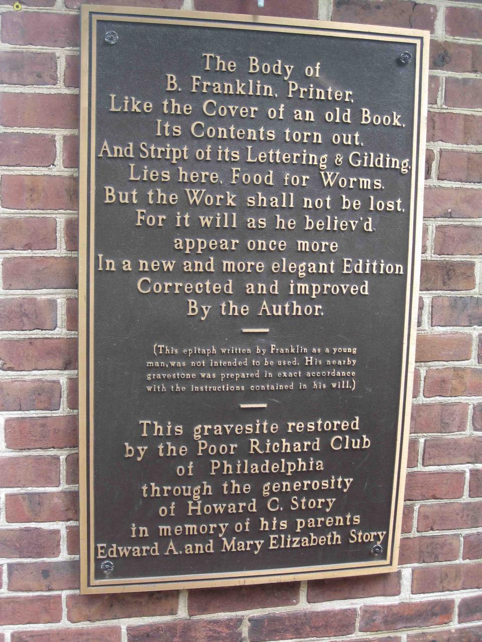 A photo of a plaque at the gravesite of Benjamin Franklin in Philadelphia, Pennsylvania.